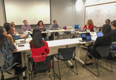 DCEC members sitting around a table at a meeting